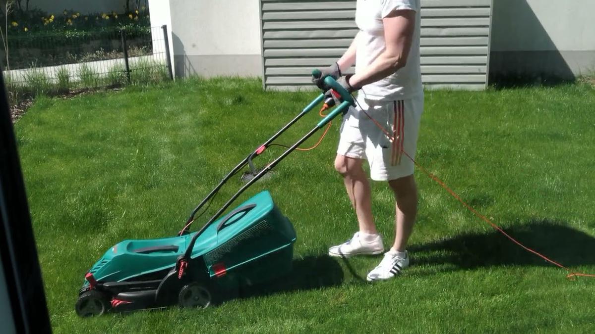 'Video thumbnail for Man At Chores: Mowing Beautiful Green Garden Lawn'